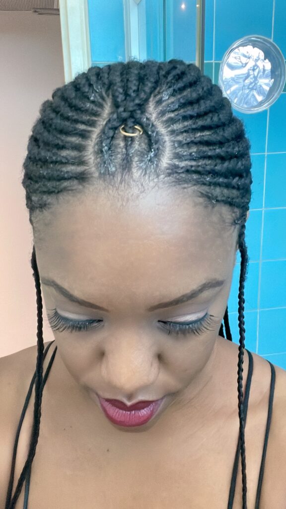 Fulani braids with gold ring and Oualichi Cosmetics lashes